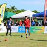 Dynamic petanque tournament scene showcasing fopikotabontang.org with players in action.